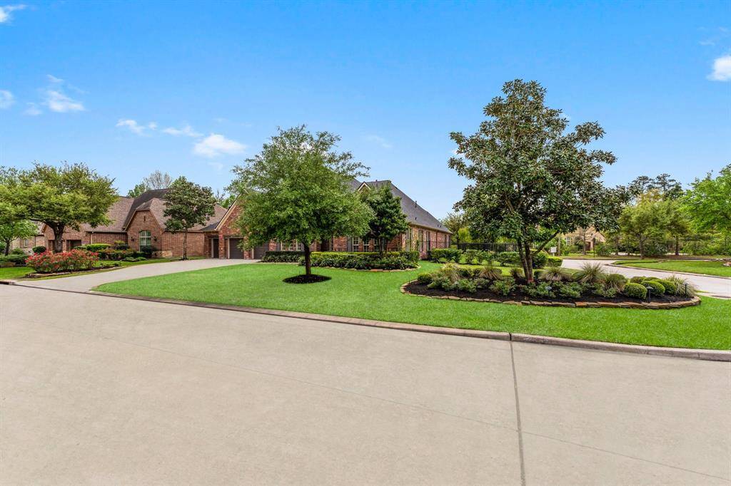 Corner lot with meticulous landscape