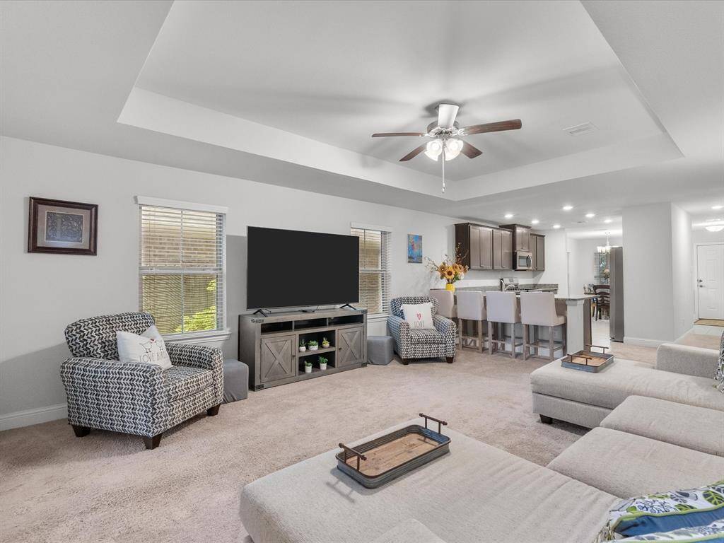 A large, open living room provides plenty of space for all your needs.