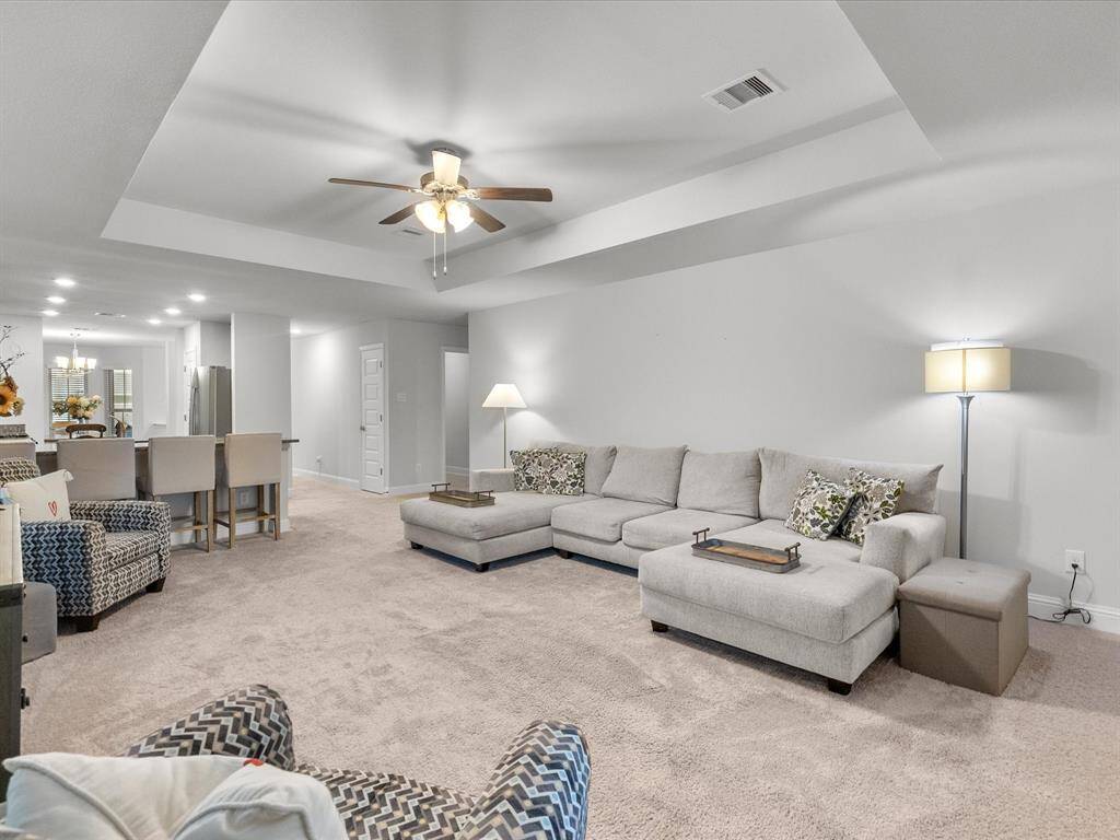 A different view of the spacious living room, showcasing its inviting layout.