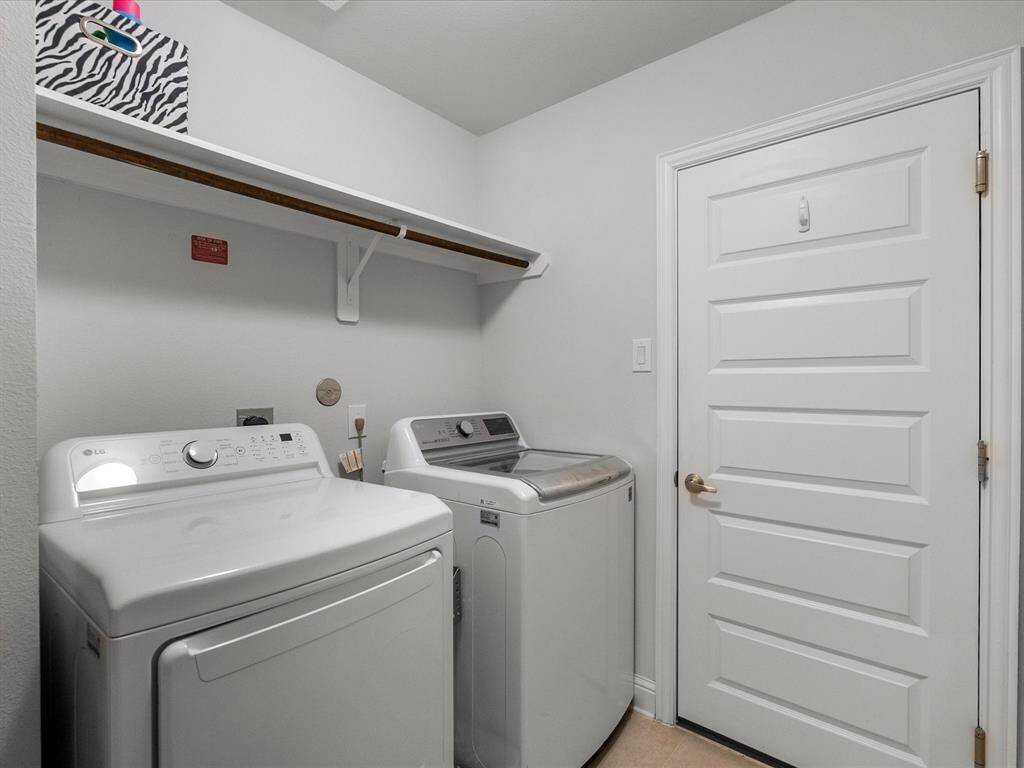 A functional utility room with seamless access to the garage