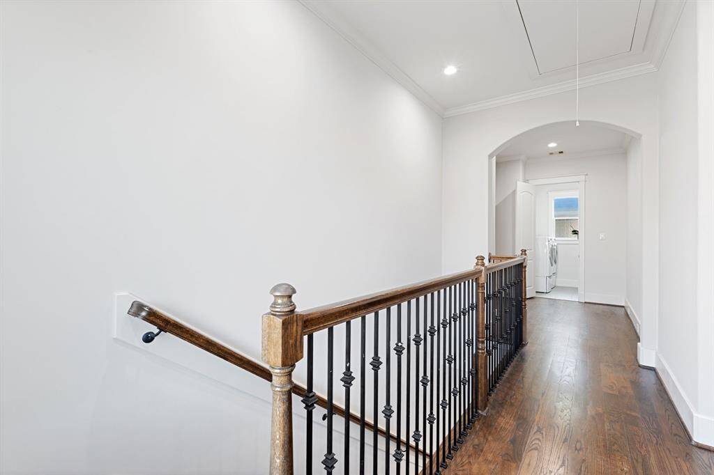 The third floor has beautiful flooring and archways.