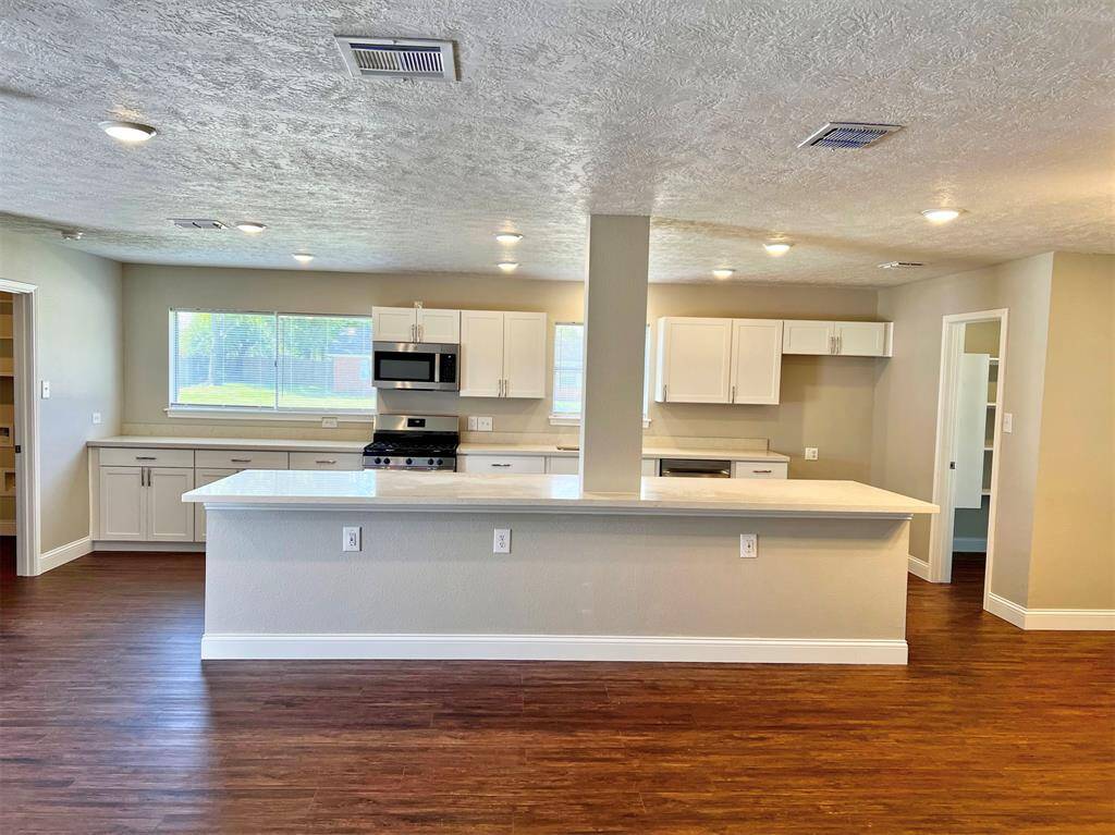 Custom built kitchen with expansive island which is perfect for entertaining.