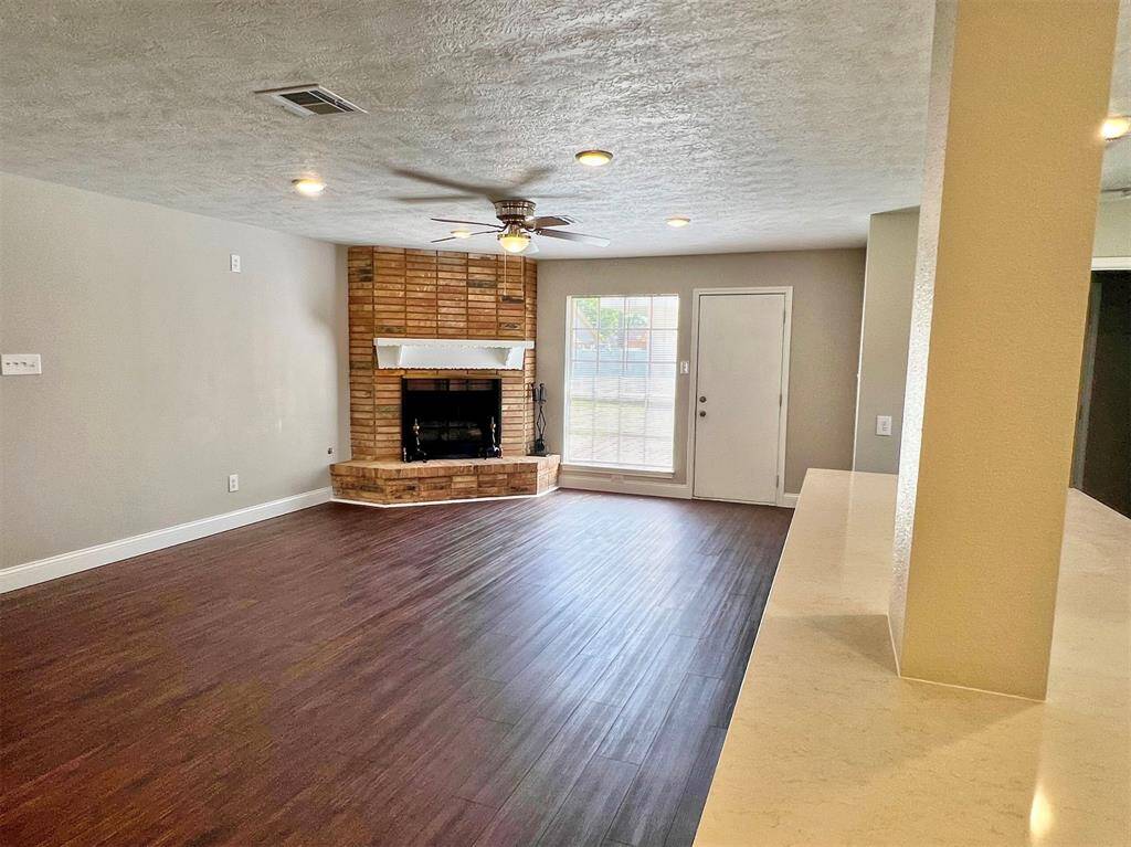 Open concept living featuring a gas fireplace