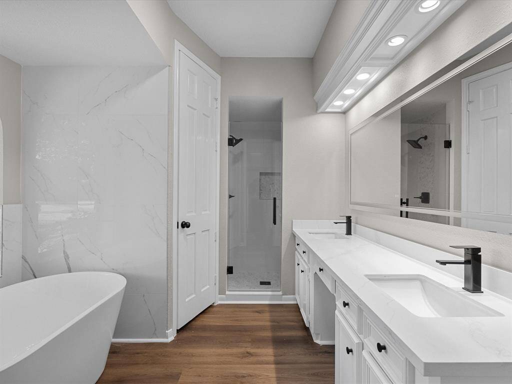 Gorgeous Primary Suit Bath with Touch Lite Mirror, Double Vanity, New Soaker Tub and Freshly Tiled Walk-in Shower