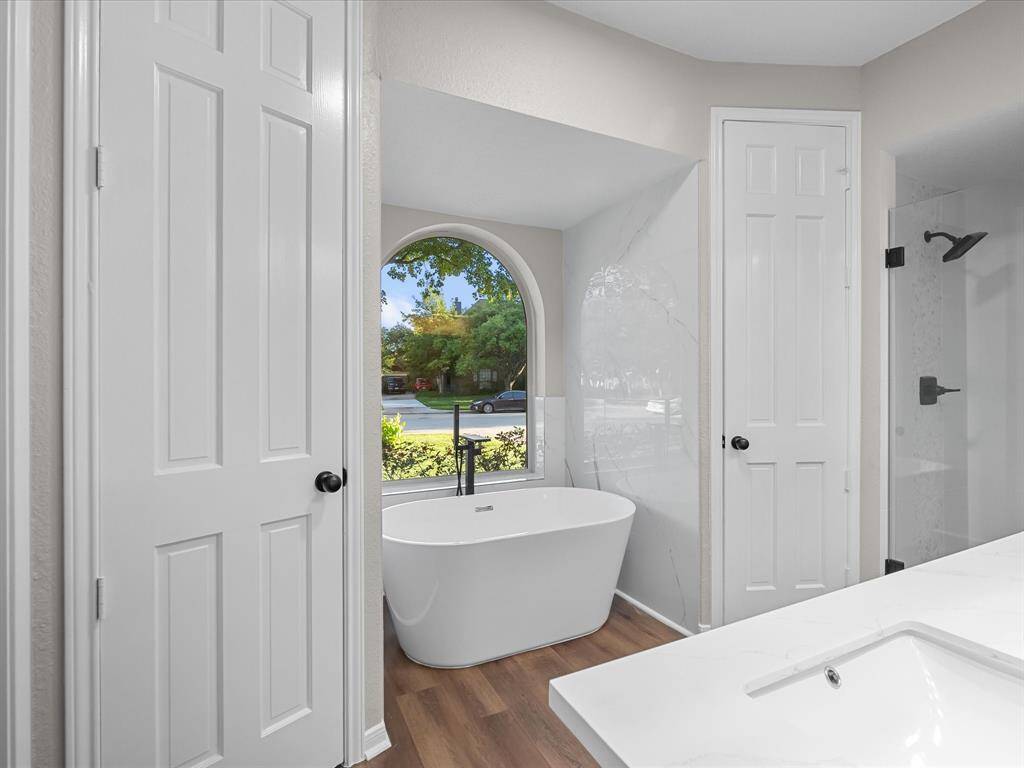 Soaker Tub Surrounded by Stylish Tiled Walls