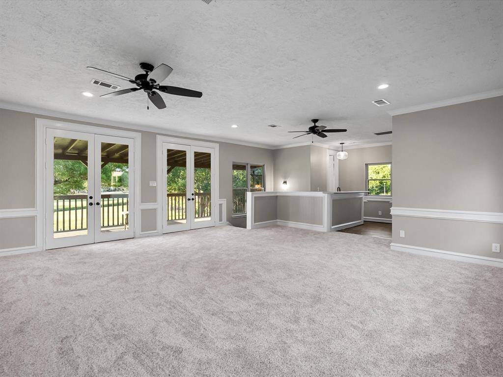 Large Open Game Room with Wet Bar that Opens to Large Balcony Overlooking the Golf Course