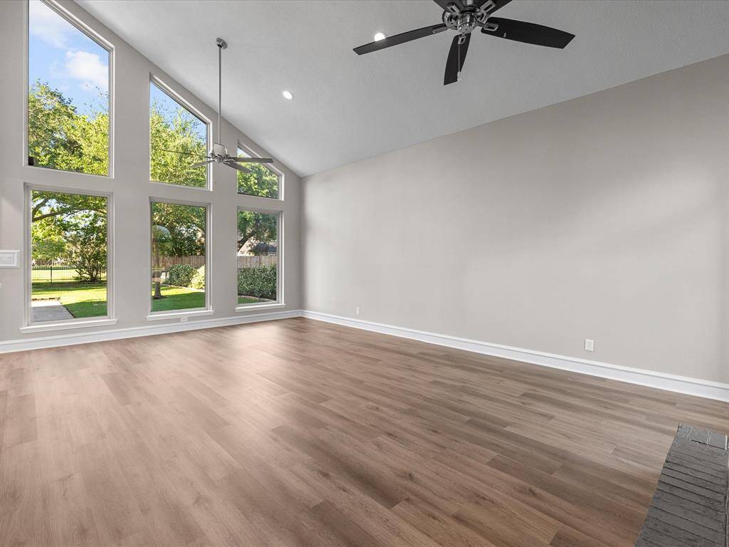 Soaring Ceilings with Walls of Windows Overlooking the Golf Course.