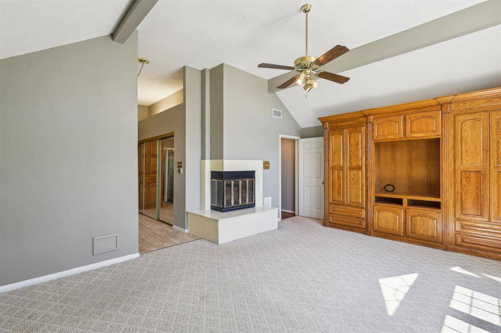 Primary Bedroom w/ Built-ins & Fireplace