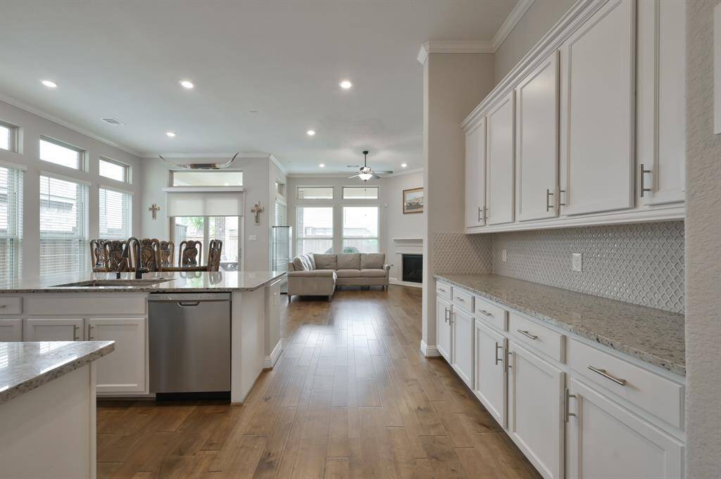 As you step into the kitchen, you immediately notice the sense of openness and flow. The layout is designed to encourage interaction and create a communal atmosphere, with the kitchen area flowing effortlessly into the dining and living spaces