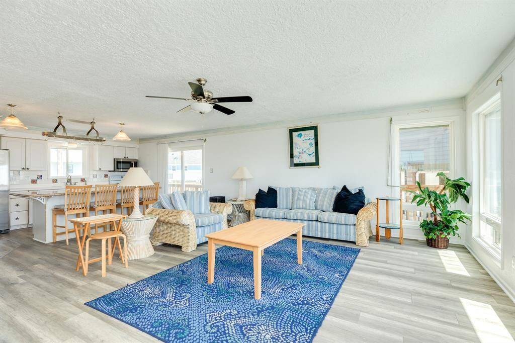 A view from the front door - Grab a drink at the oversized kitchen island or chat with the cook.  The patio door allows for gulf views as well.