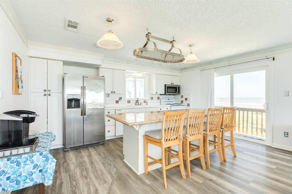 The kitchen is spacious and bright.  Plenty of space to eat at the island or you can add another table.  All appliances convey.