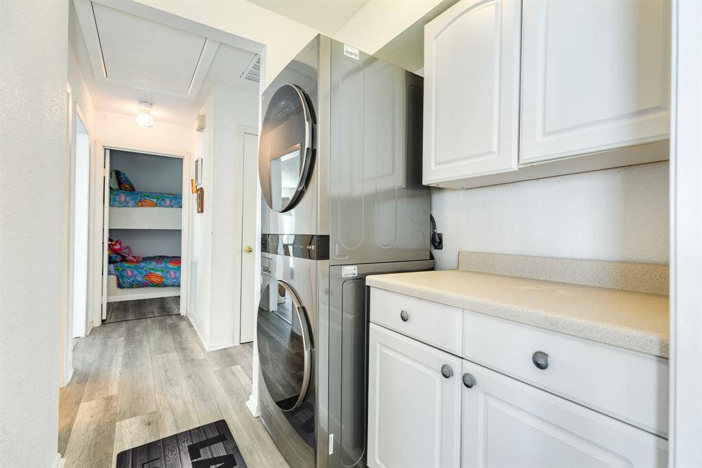 This home comes with stacked washer and dryer and more storage.