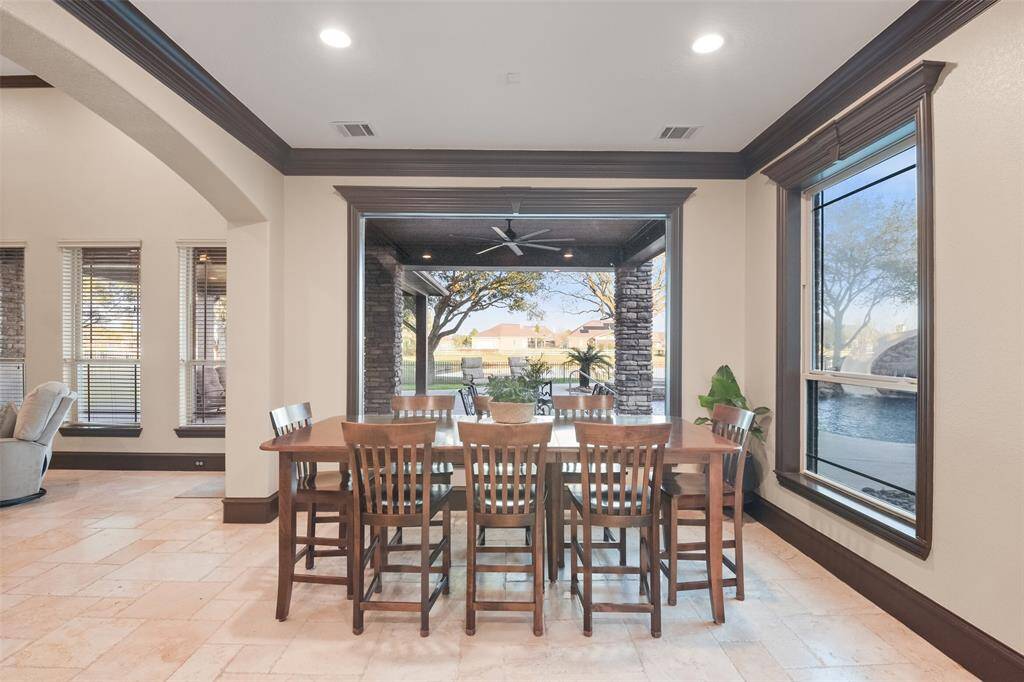 The breakfast room features a large window with unobstructed backyard views.