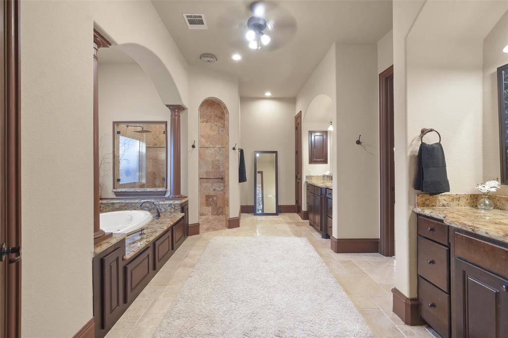 The luxurious owners bath features a jetted tub, oversized shower and dual vanities.