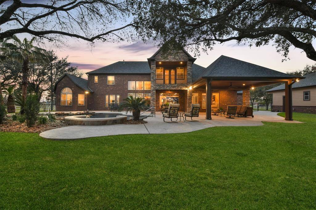 Spectacular backyard oasis is ideal for entertaining or just relaxing and enjoying the peaceful surroundings.