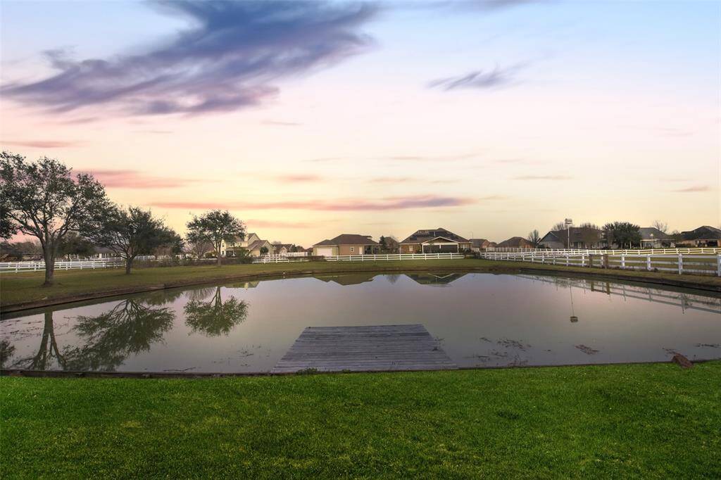 Enjoy fishing in your own backyard from the deck of the stocked pond.