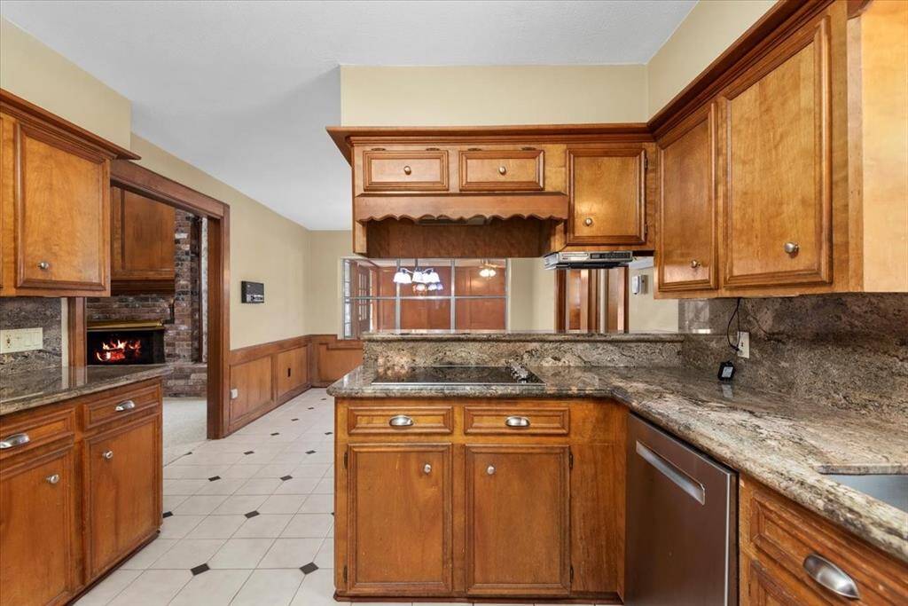 This home has a central vacuum system. You can see a connection to the right of the doorway into the living room- near the floor.
