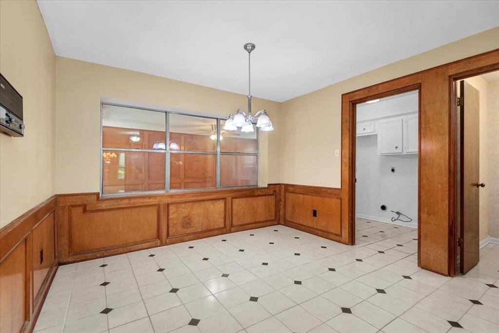 Doorway to the far right opens into the powder room. The next doorway to the left opens into the laundry room.