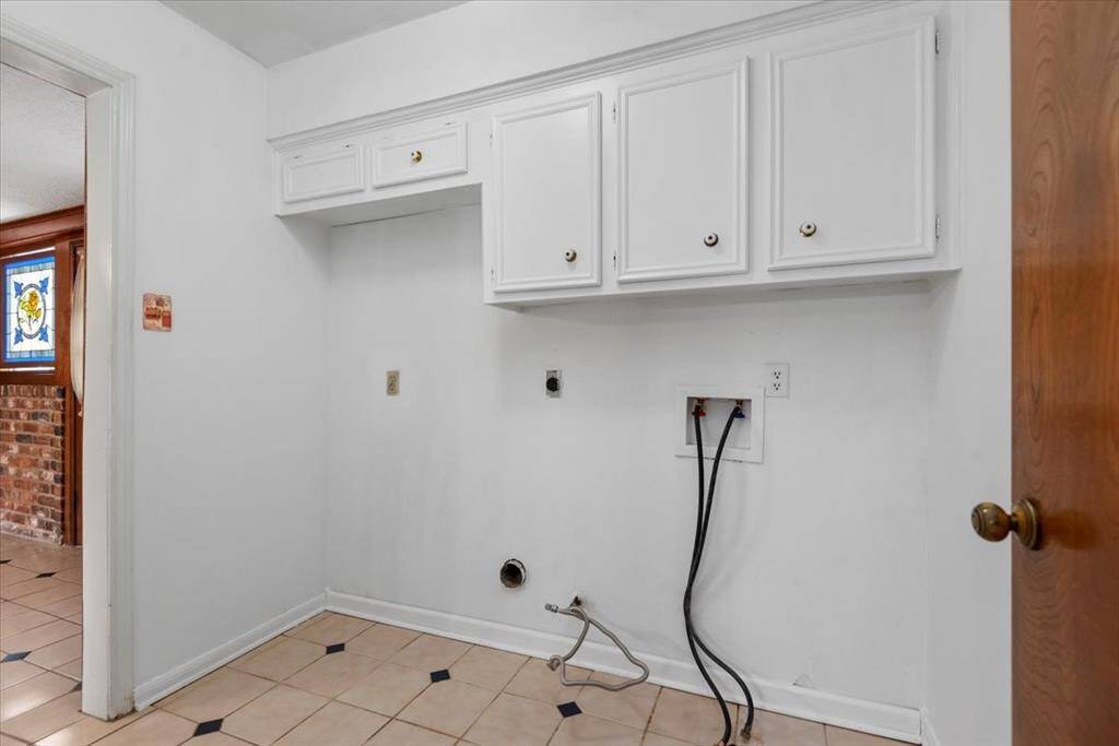 the utility room has extra space for a refrigerator or freezer as well as a washer & dryer.