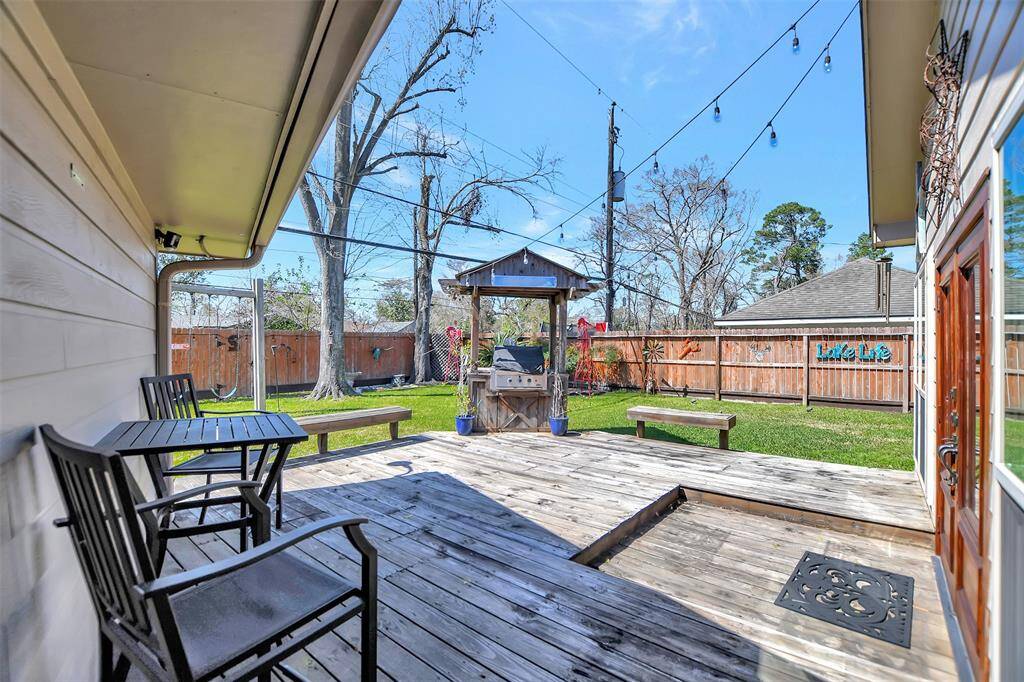 DECK OFF OF GAME ROOM  BACK DOOR, NOTICE THE OUTDOOR GRILL!