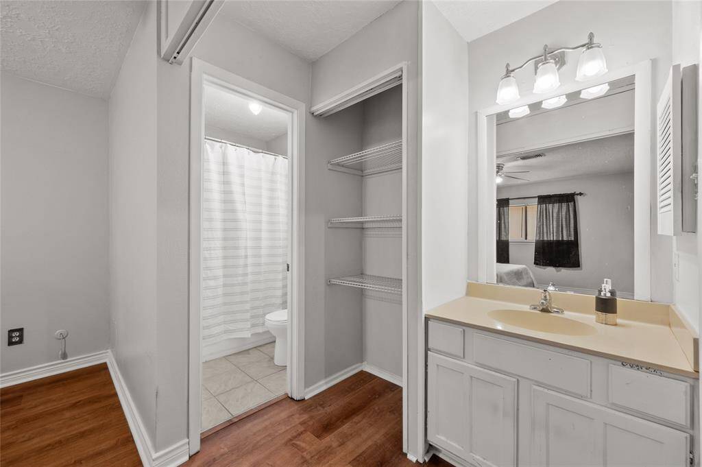 The primary bedroom features an en-suite bathroom with a shower/tub combo.