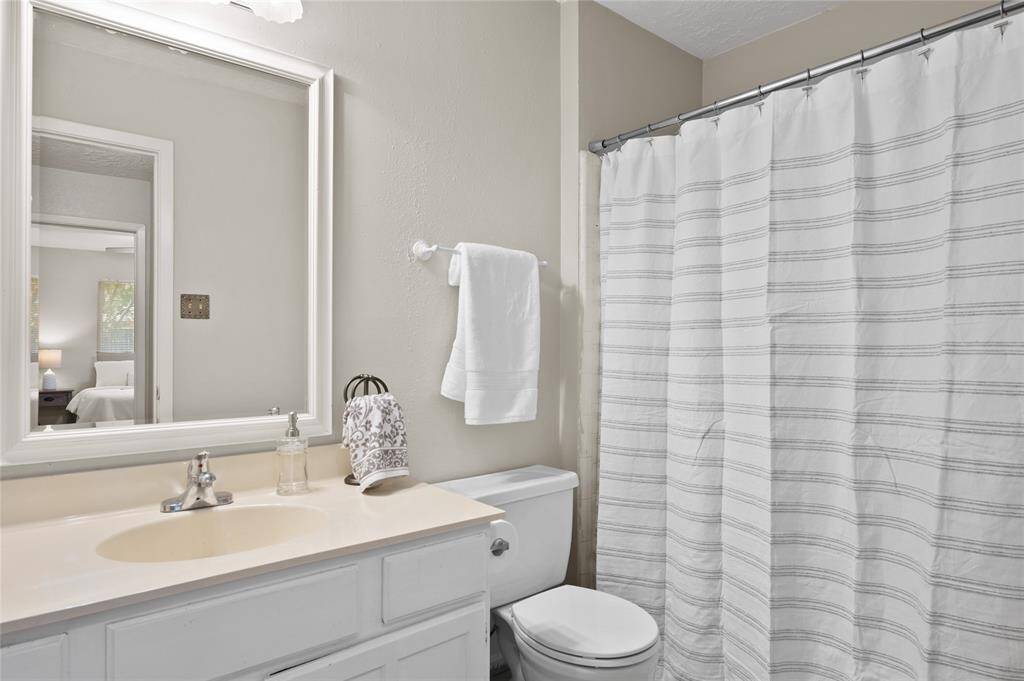 The secondary bathroom features a shower/tub combo.
