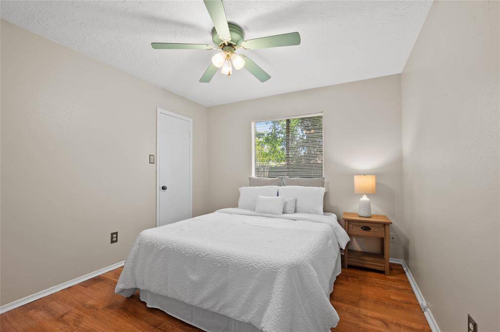 Bedroom 3 features newly installed LVP flooring and has a large walk-in-closet.