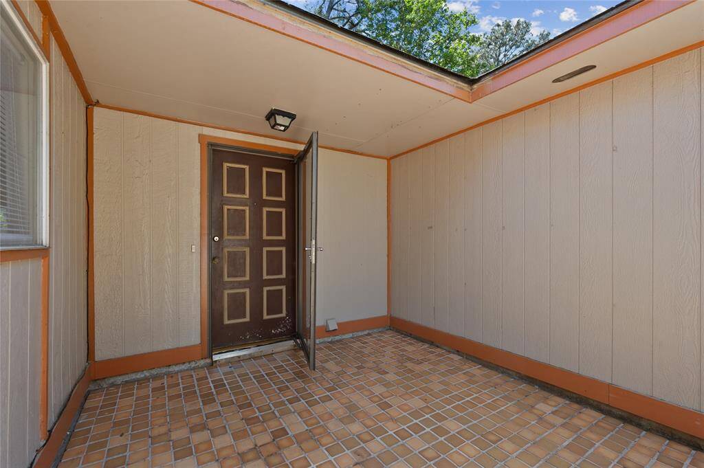 A unique tile courtyard welcomes you into this home.
