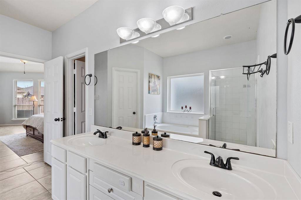 Though there’s a single vanity, it includes dual sinks—offering both style and convenience for daily routines.