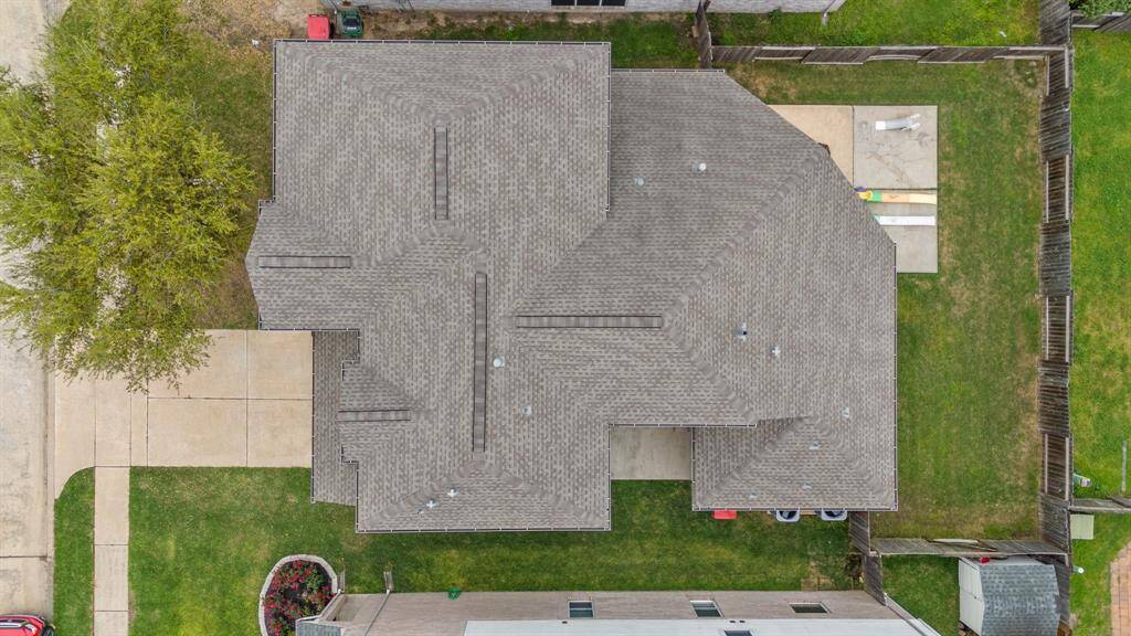 An aerial view of the home showcasing the roof’s well-maintained condition—offering both curb appeal and long-term peace of mind.