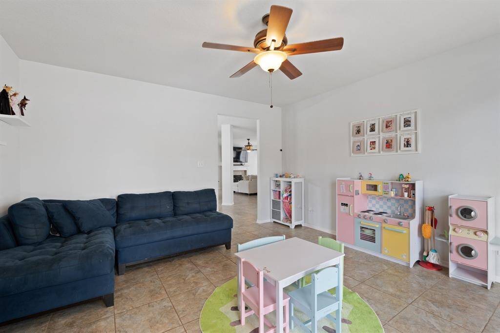 As you leave the den, you’ll notice how seamlessly it connects to both the entry and formal dining room—a bright, flexible space that adapts to your lifestyle needs.