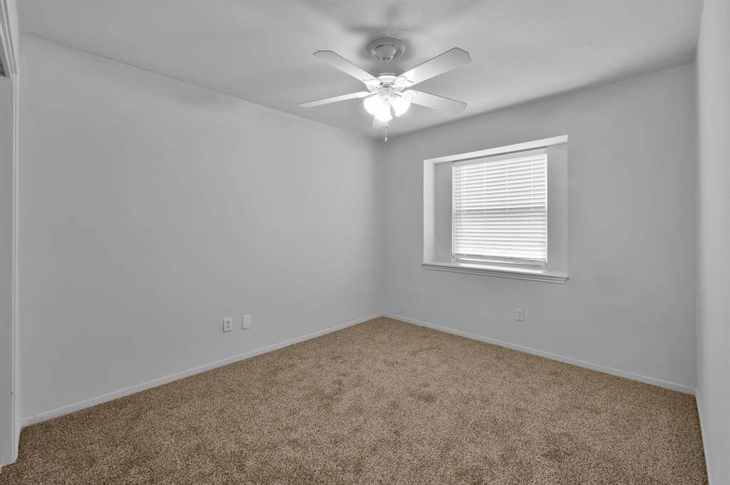 One of three secondary bedrooms
