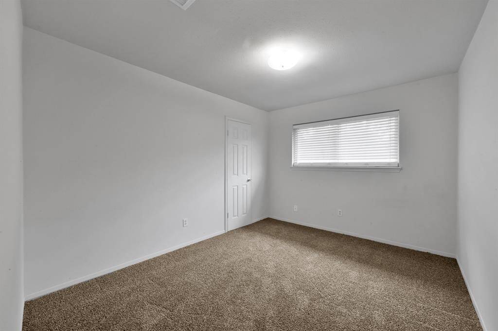Another of the three secondary bedrooms.