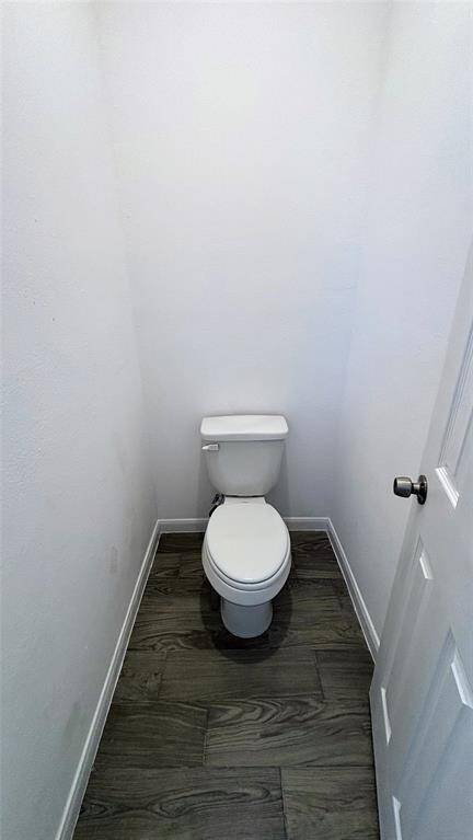The master  bathroom featuring a separate toilet.