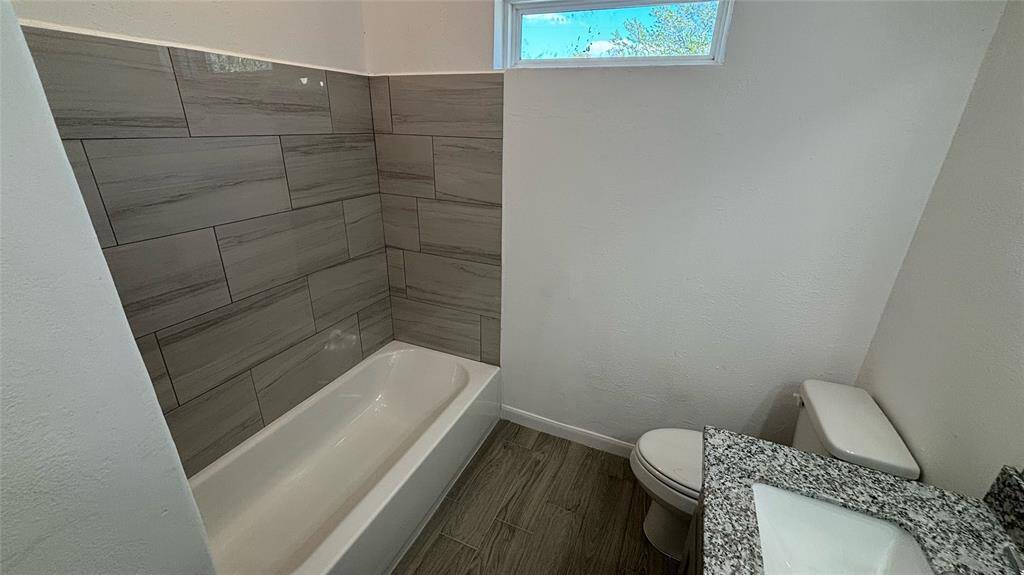 Bright, spacious secondary bathroom.