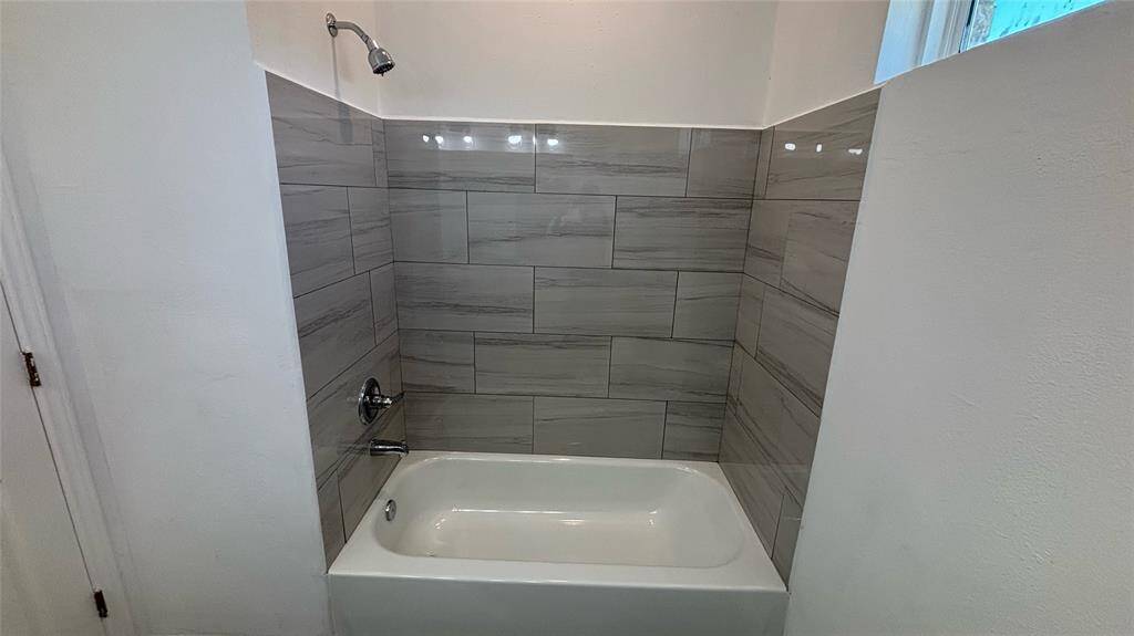 Bright, spacious secondary bathroom.