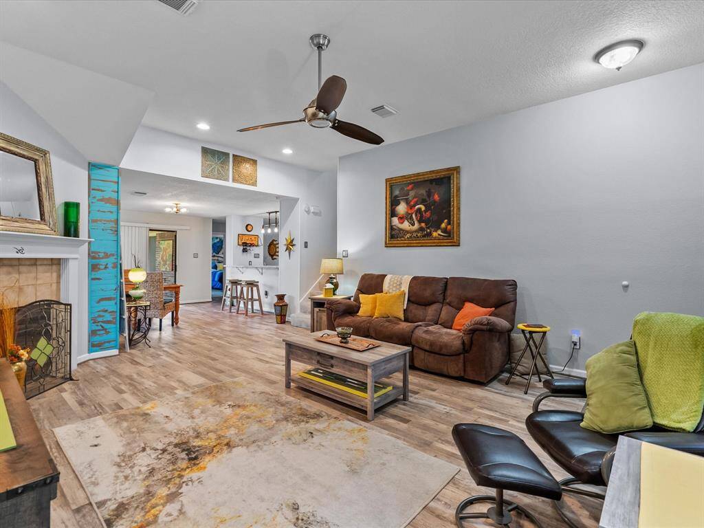 The wood look plank flooring fills the entire space and flows right into the dining room.