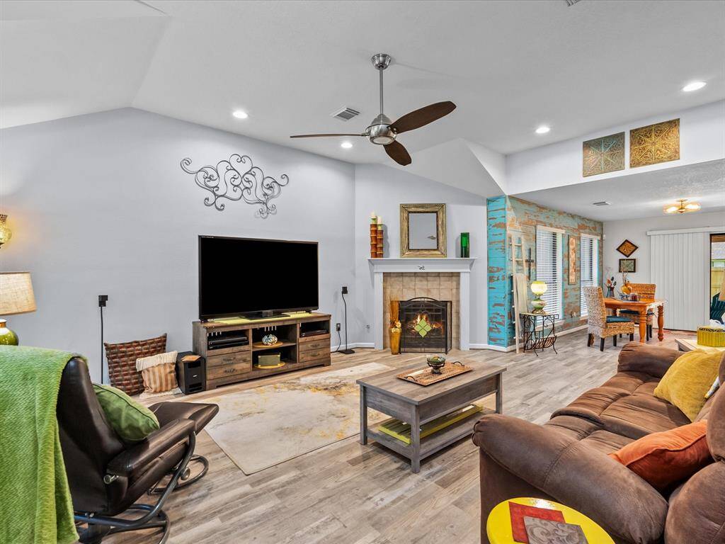 Then step inside and take in the high ceilings, fireplace and plenty of wall space for your large TV.