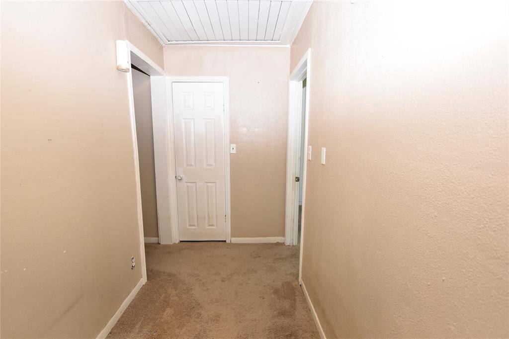 A classic hallway design that leads to all three bedrooms and the full bathroom—creating a functional flow throughout the home.