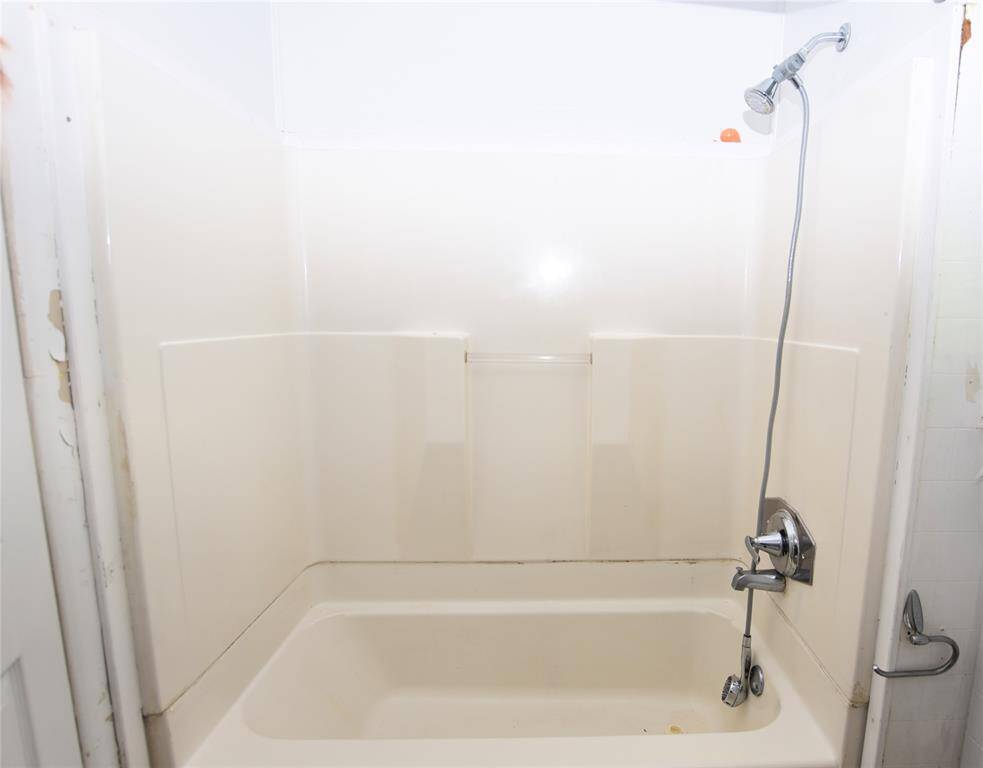 A classic tub-shower combo that maximizes space while providing both a relaxing bath and convenient shower option.
