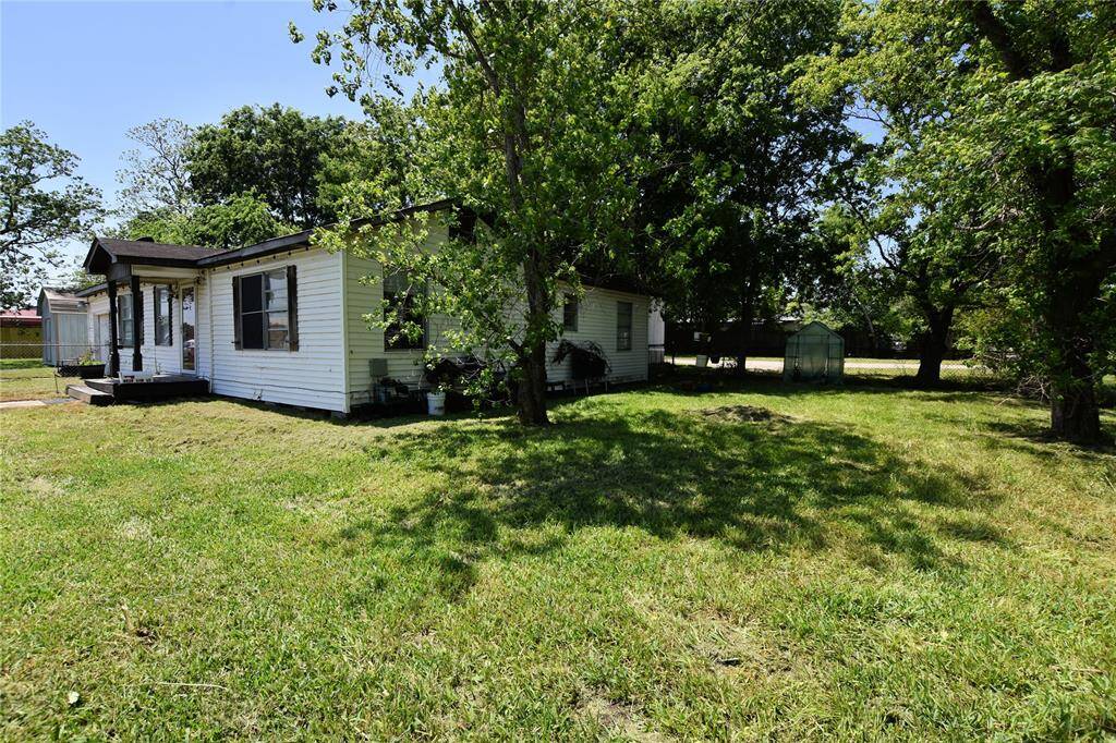 Generous lot with a fenced yard, ideal for entertaining or future landscaping projects.
