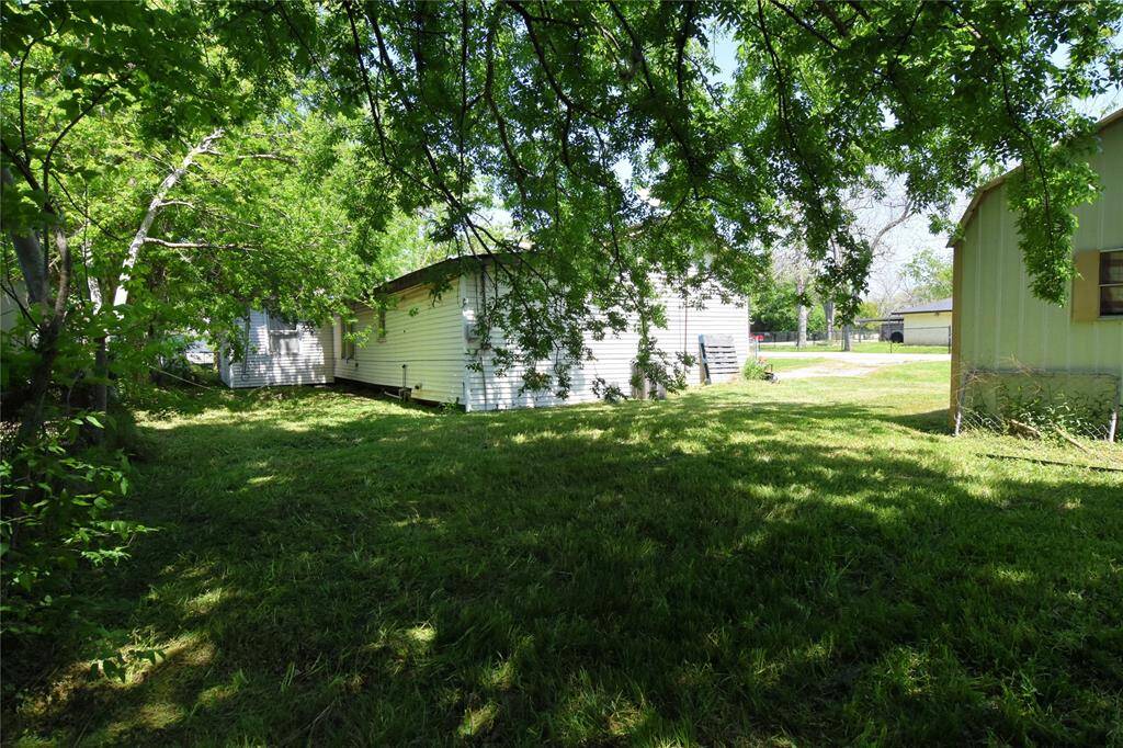 The large lot offers endless possibilities—use it for outdoor hobbies or as a private oasis.