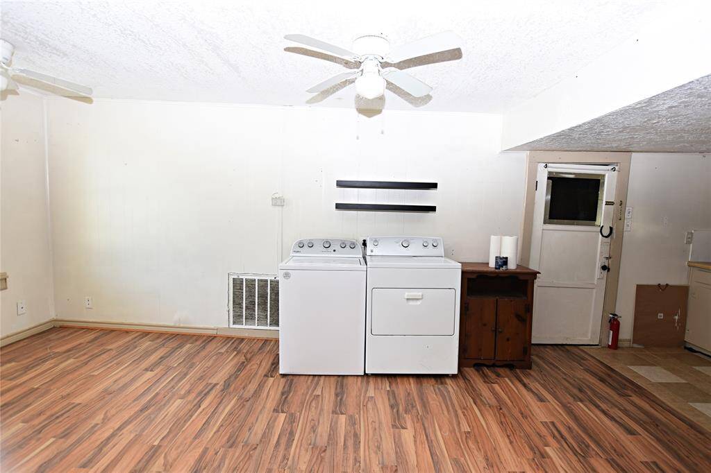 Open kitchen and dining combo offers a practical layout with plenty of space for cooking, dining, and gathering. Washer & Dryer Excluded in Sale.