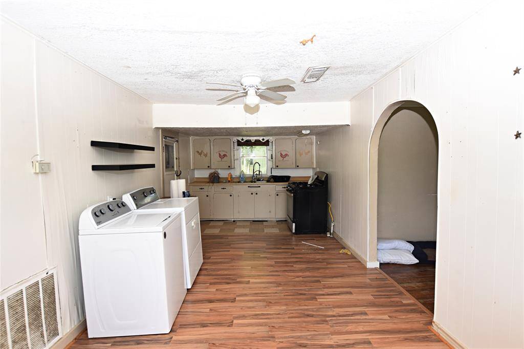 With a little updating, this versatile space could shine as the heart of the home. Washer, Dryer and Stove Excluded in Sale.