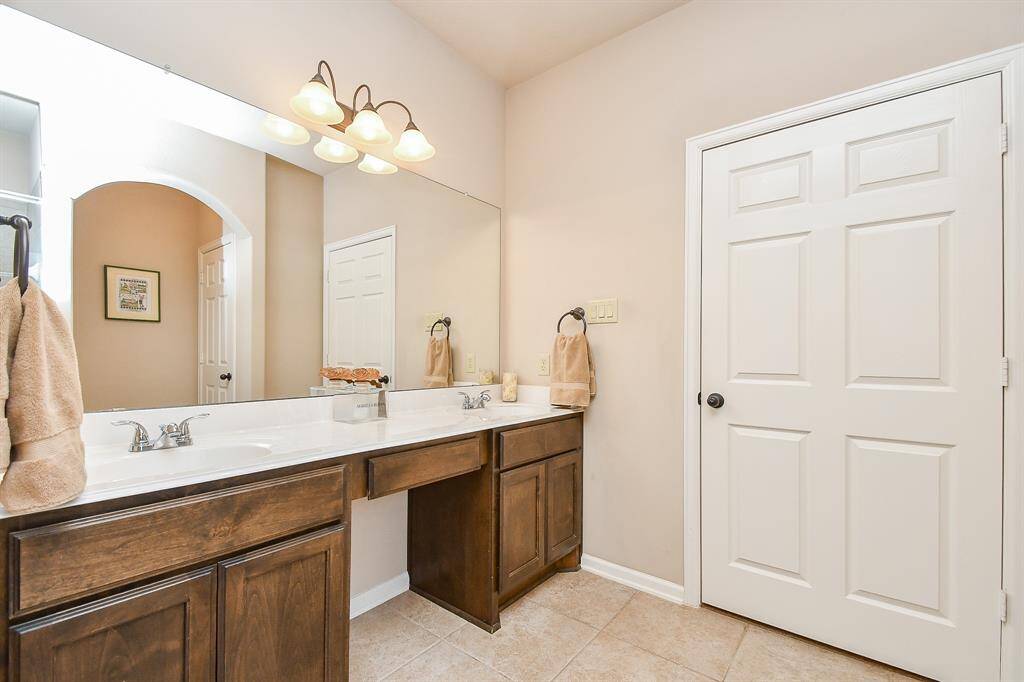 The dining area is between the kitchen and living room.