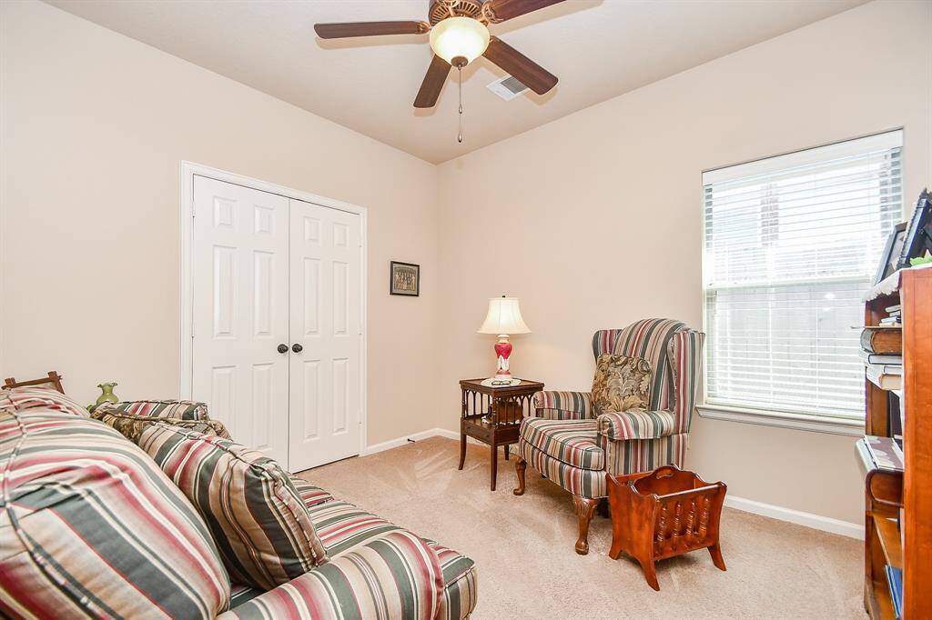 The home boasts an open floor plan with generous living spaces, granite countertops, elegant cabinetry, and tile flooring throughout the family room, hallways, kitchen, breakfast nook, and bathrooms.