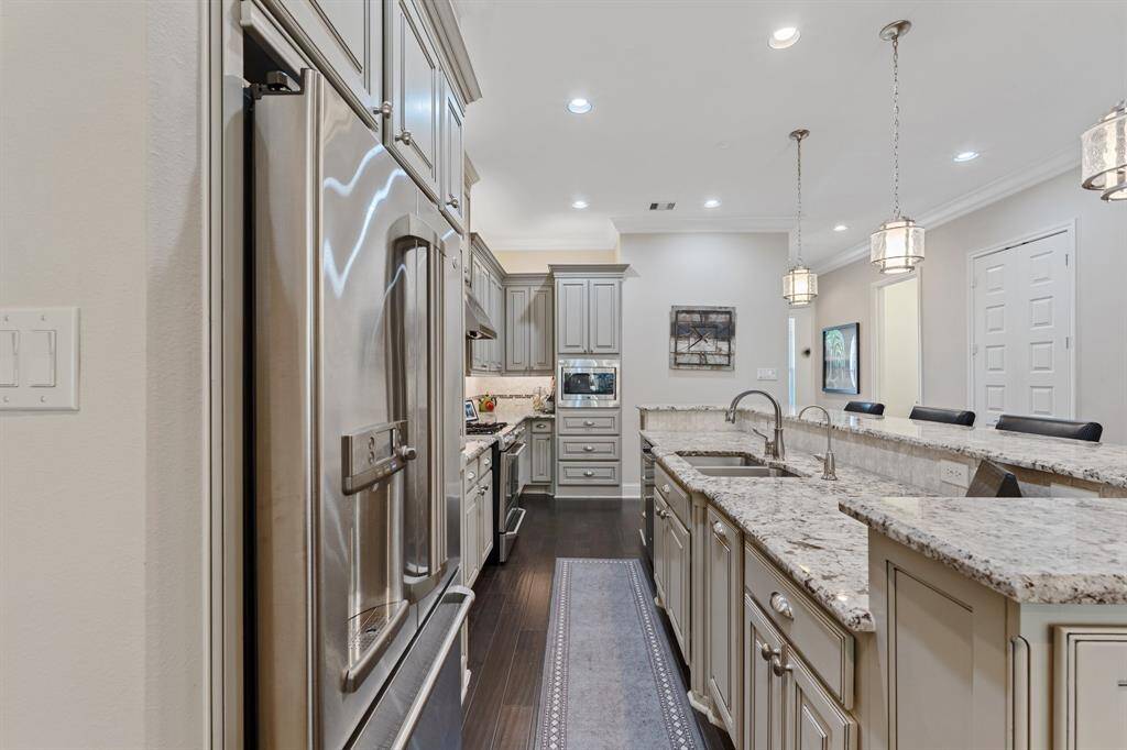 Upgraded cabinetry and granite with plenty of counterspace and storage.