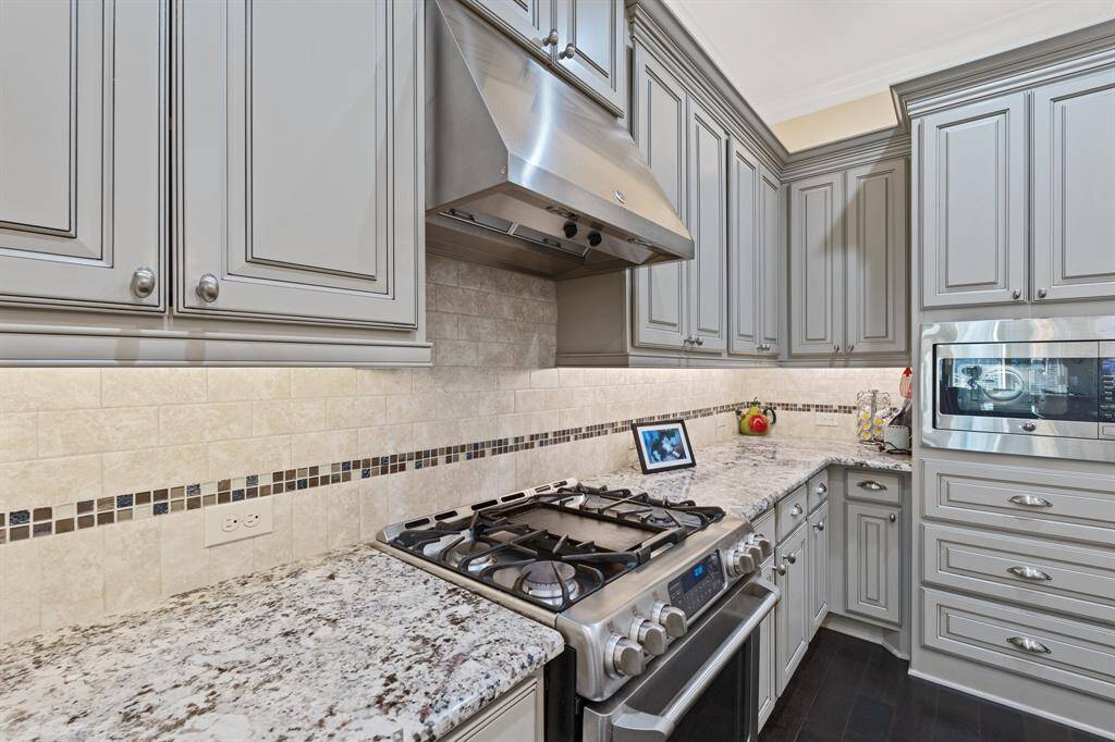 Gourmet kitchen is complete with Cafe appliances.