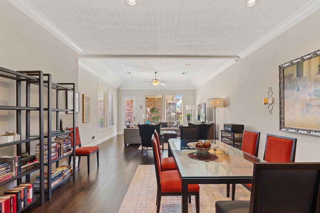 Family room is light and bright from the large windows.  Nice big space for eating your meals with beautiful views of the outdoor back covered patio.