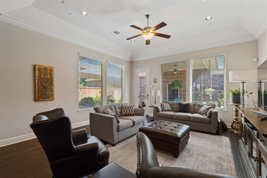 Family room is light and bright from the large windows.  Great views of the serene outdoor covered patio.